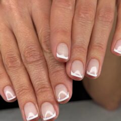 Modern French tip manicure with geometric white tips - winter nail trends Boise 2025